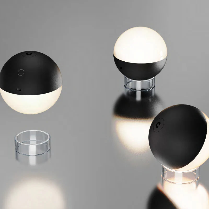 SPAZIO Albedo Rechargeable LED Orb – black and white orbs shown with their bases