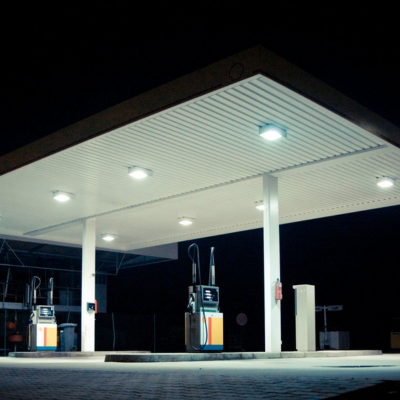 Synerji LED Canopy Fitting – lit fittings under a service-station canopy at night