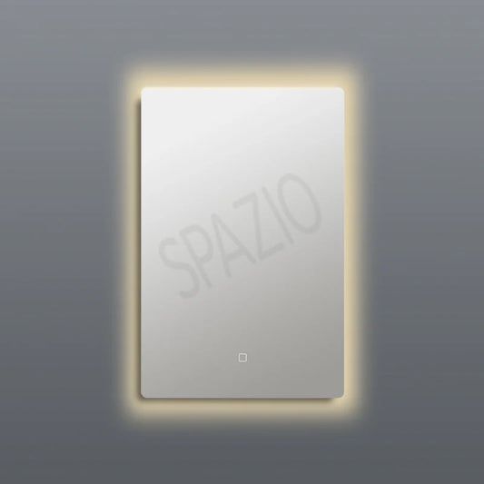 SPAZIO Iseo Back-Lit LED Mirror – lit mirror with a warm glow on a grey wall