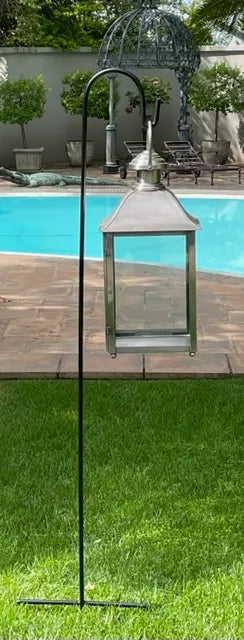 Classic Candle Lantern – lantern on a garden stand beside a pool