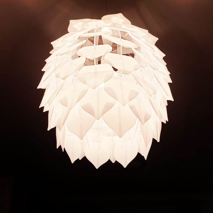 Honey Badger Pinopoly Pendant Light – close-up of the lit frosted white petals
