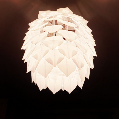 Honey Badger Pinopoly Pendant Light – close-up of the lit frosted white petals