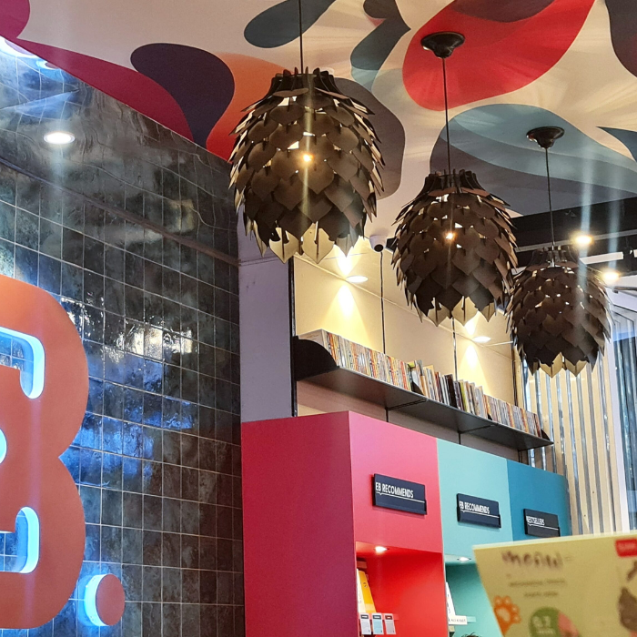 Honey Badger Pinopoly Pendant Light – satin black pendants in a colourful café