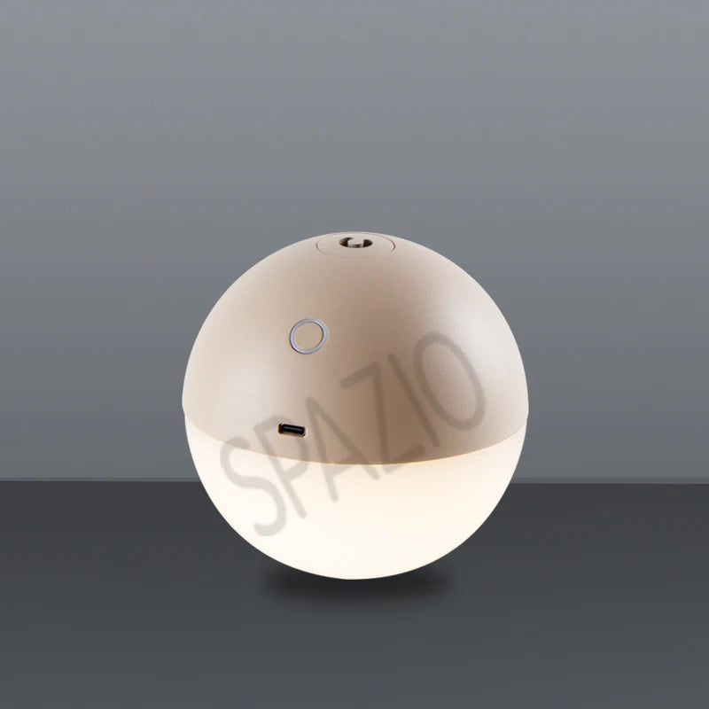 SPAZIO Albedo Rechargeable LED Orb – lit orb on a grey surface