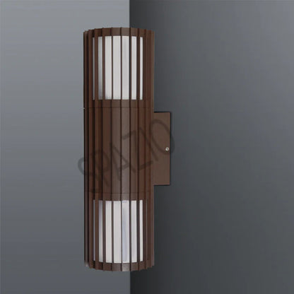 SPAZIO Paso Doblo Up & Down Outdoor Wall Light – Corten finish on a grey wall