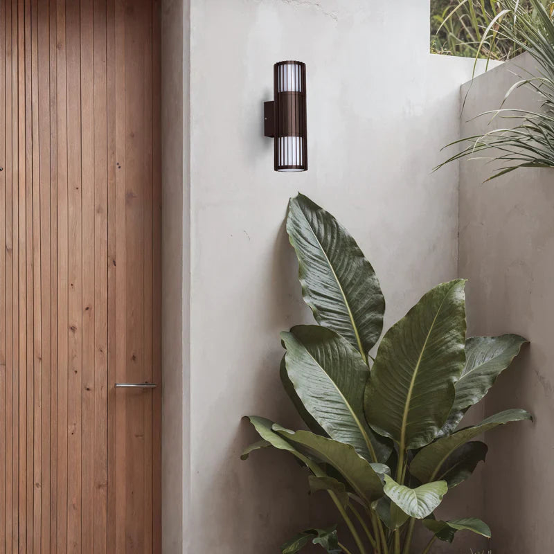 SPAZIO Paso Doblo Up & Down Outdoor Wall Light – mounted beside a timber front door