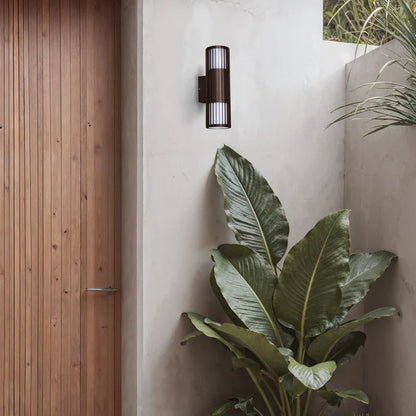 SPAZIO Paso Doblo Up & Down Outdoor Wall Light – mounted beside a timber front door