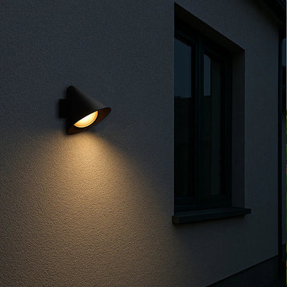 SPAZIO Railroad 1 Outdoor Wall Light – lit on an outdoor wall at night