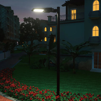 SPAZIO Sunstreet Solar LED Street Light – lit on a pole in a garden at night