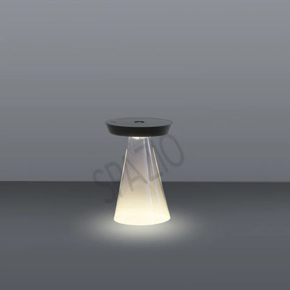 SPAZIO Torus Glass Rechargeable Desk Lamp – lit lamp on a grey background