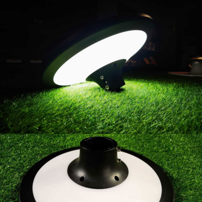 Synerji 20W Solar LED Street Light – lit street light head over a lawn, with a close-up of the pole fitting