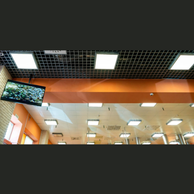 Synerji 40W CCT Backlit LED Panel – lit panels in an office ceiling